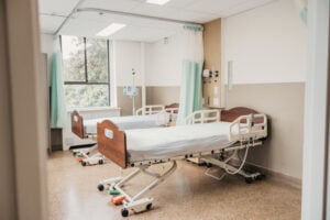 Participant beds inside the Mount Saint Joseph Hospital Phase 1 Clinical Trials Unit designed for early-stage clinical research and volunteer monitoring.
